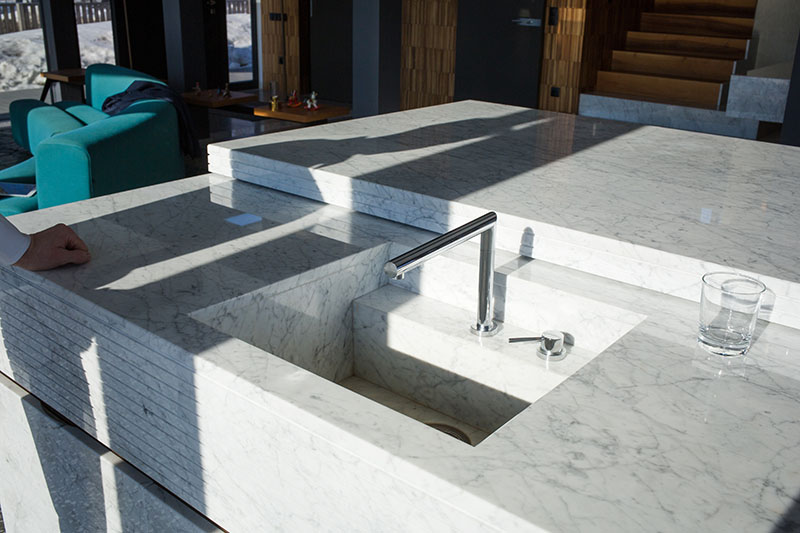 Marble countertop installation featuring an elegant, luxury kitchen design.